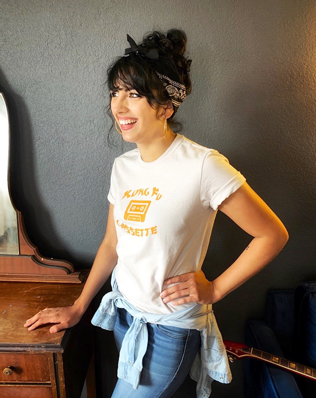 Female musician wearing custom printed band T-shirt
